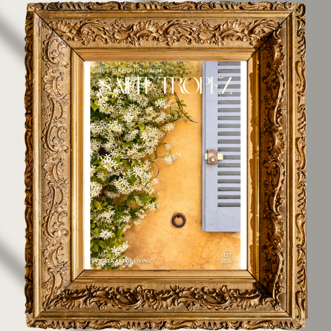 #052 Saint Tropez Wall Art Print - A warm ochre yellow wall, ornate white flowers and a characteristic blue-gray hatch